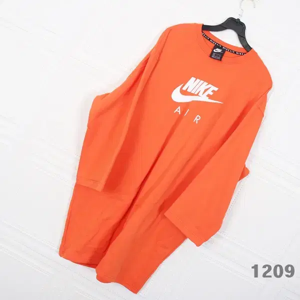 nike women's xl orange overfit onepiece with a pretty colorful pattern