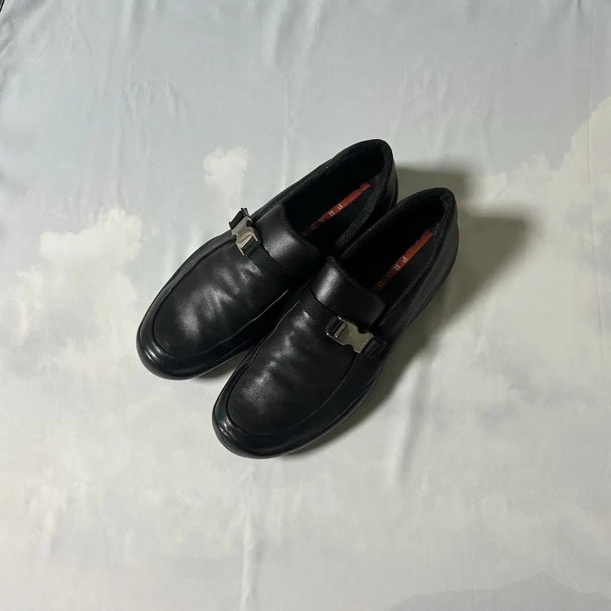 Prada sports buckle slipon loafers