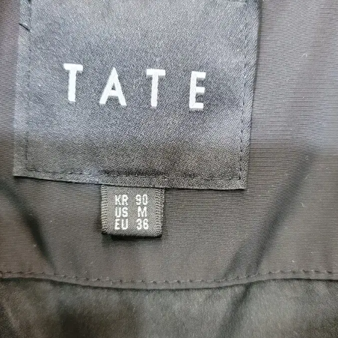 TATE 롱패딩 사이즈는 90 검정색 남여공용