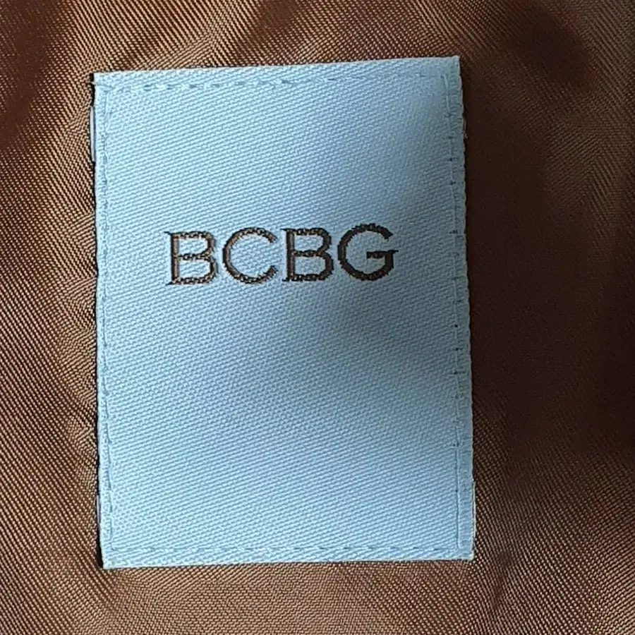 BCBG 여성 라쿤털후드 오리털 롱패딩