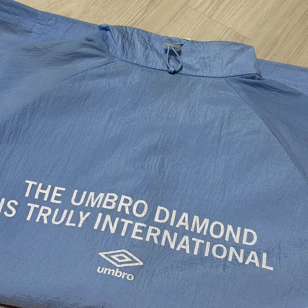 [L] 엄브로 UMBRO 크링클 스탠넥 바람막이 자켓 라이트블루