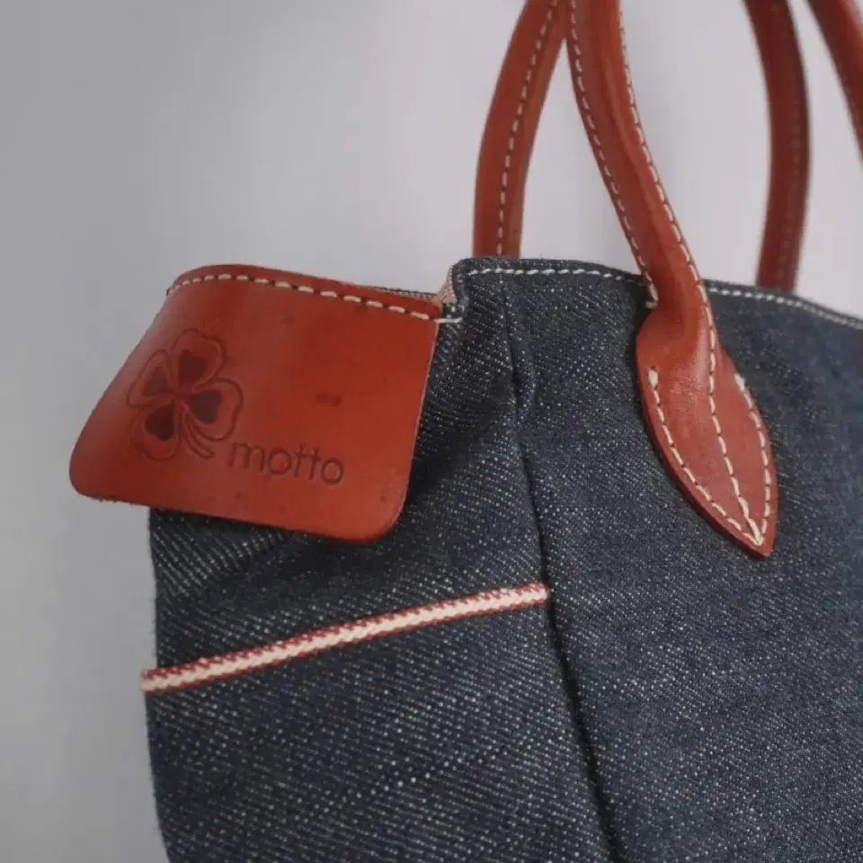 motto denim leather bag