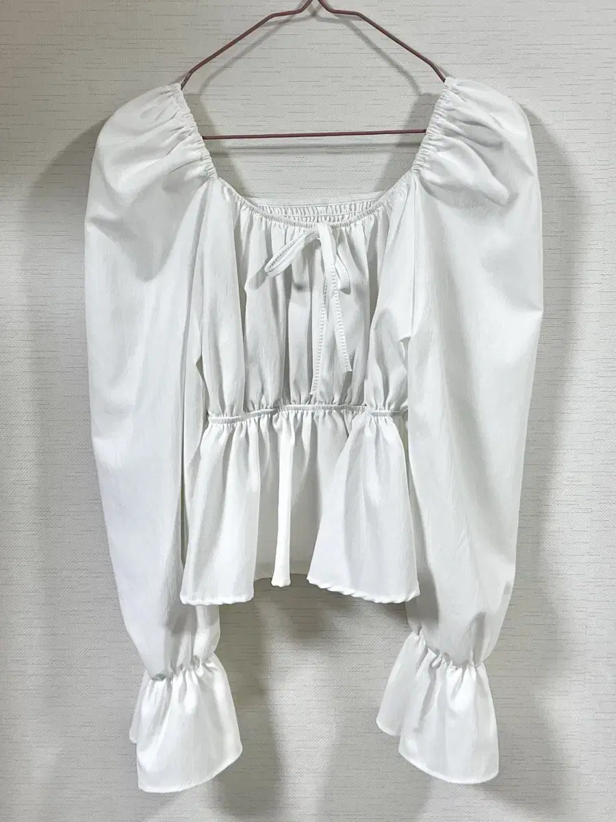 White ruffled blouse