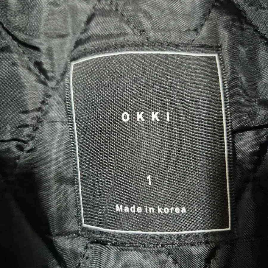 OKKI 오버핏 누빔 체크 떠블 모직코트  프리