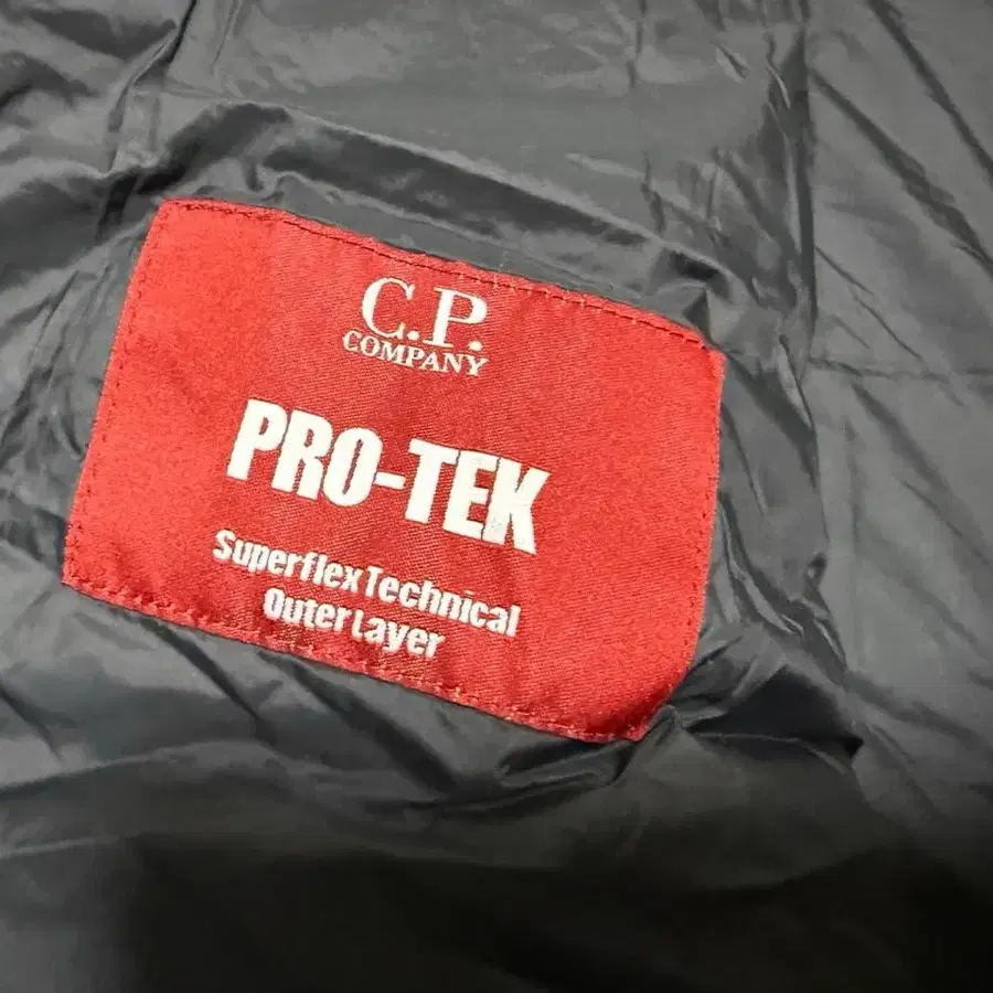 CP 컴퍼니 PRO-TEK 프리마로프트 후드 경량패딩 남성용 105사이즈