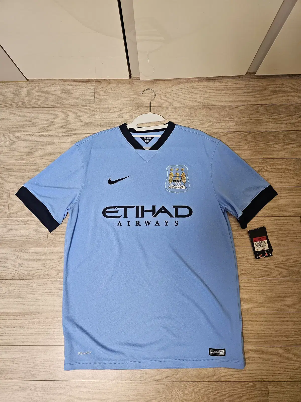 Nike 14/15 Manchester City home shirt size L for sale.