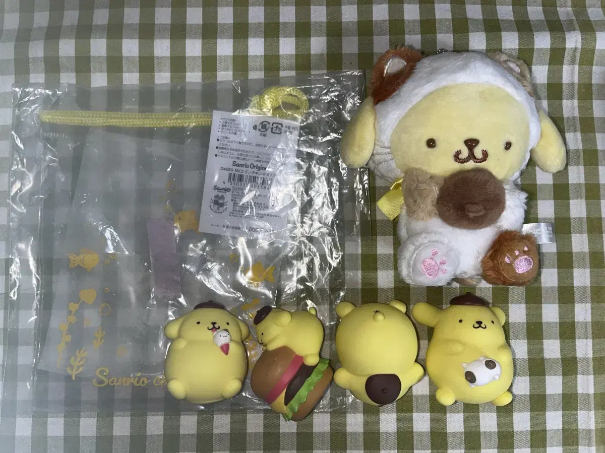 Pompompurin dolls, figures, and zipper bags