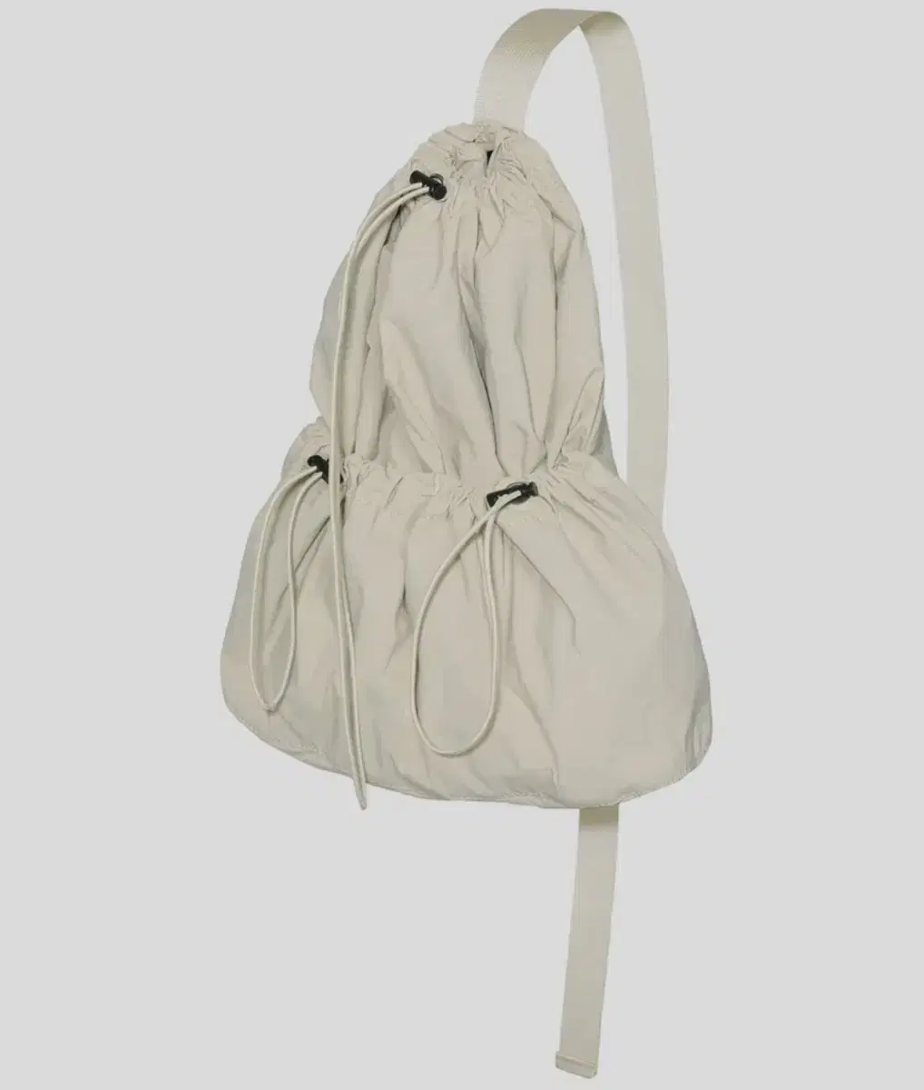 NEW) Partimento Drawstring Sling Bag Beige