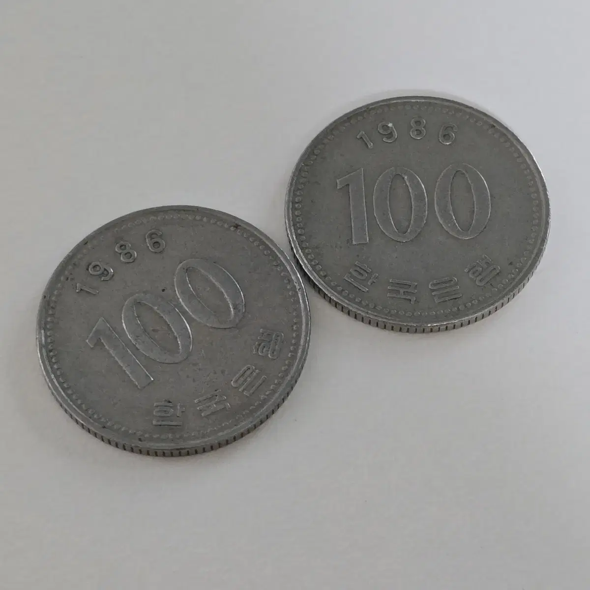 1986년 100원 동전 2개