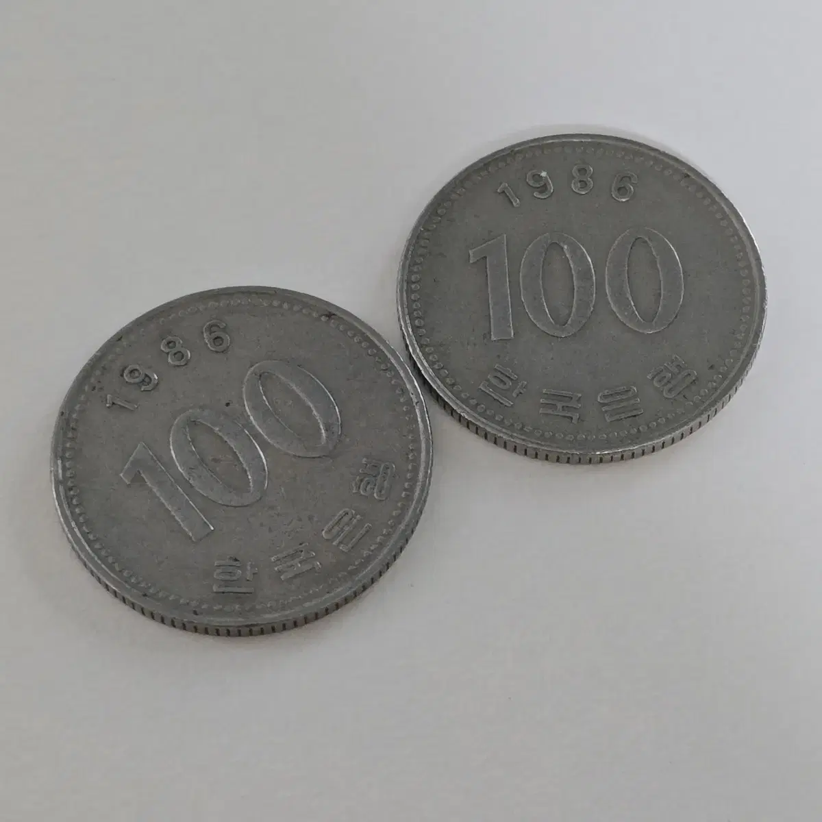 1986년 100원 동전 2개