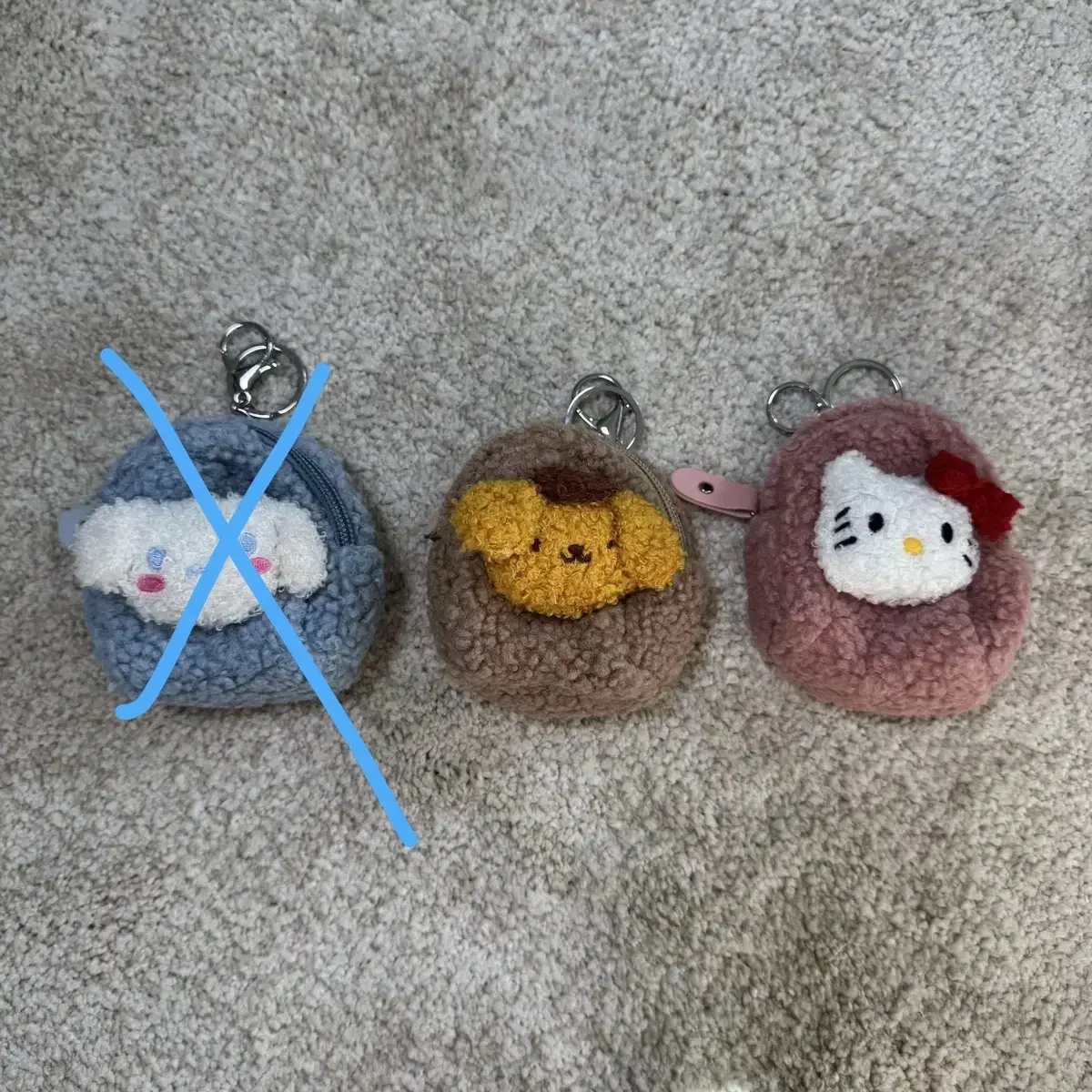 San Rio Poggle sells these mini pouches keyring 