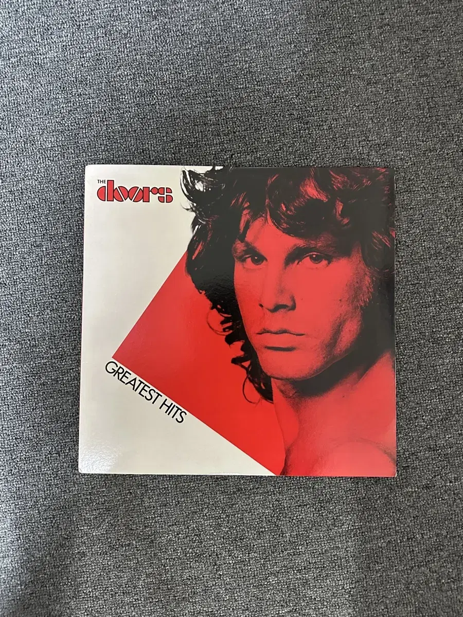 Sells vinyl records (LPs) of the Doors greatest hits compilation.