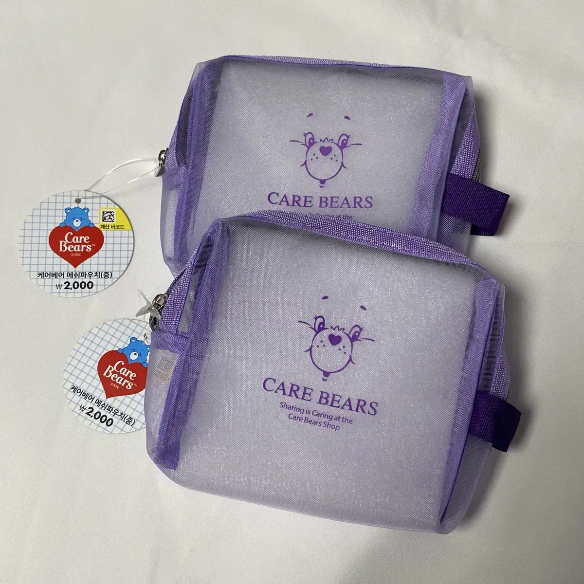 Daiso bora purple carebear pow in mesh pouch