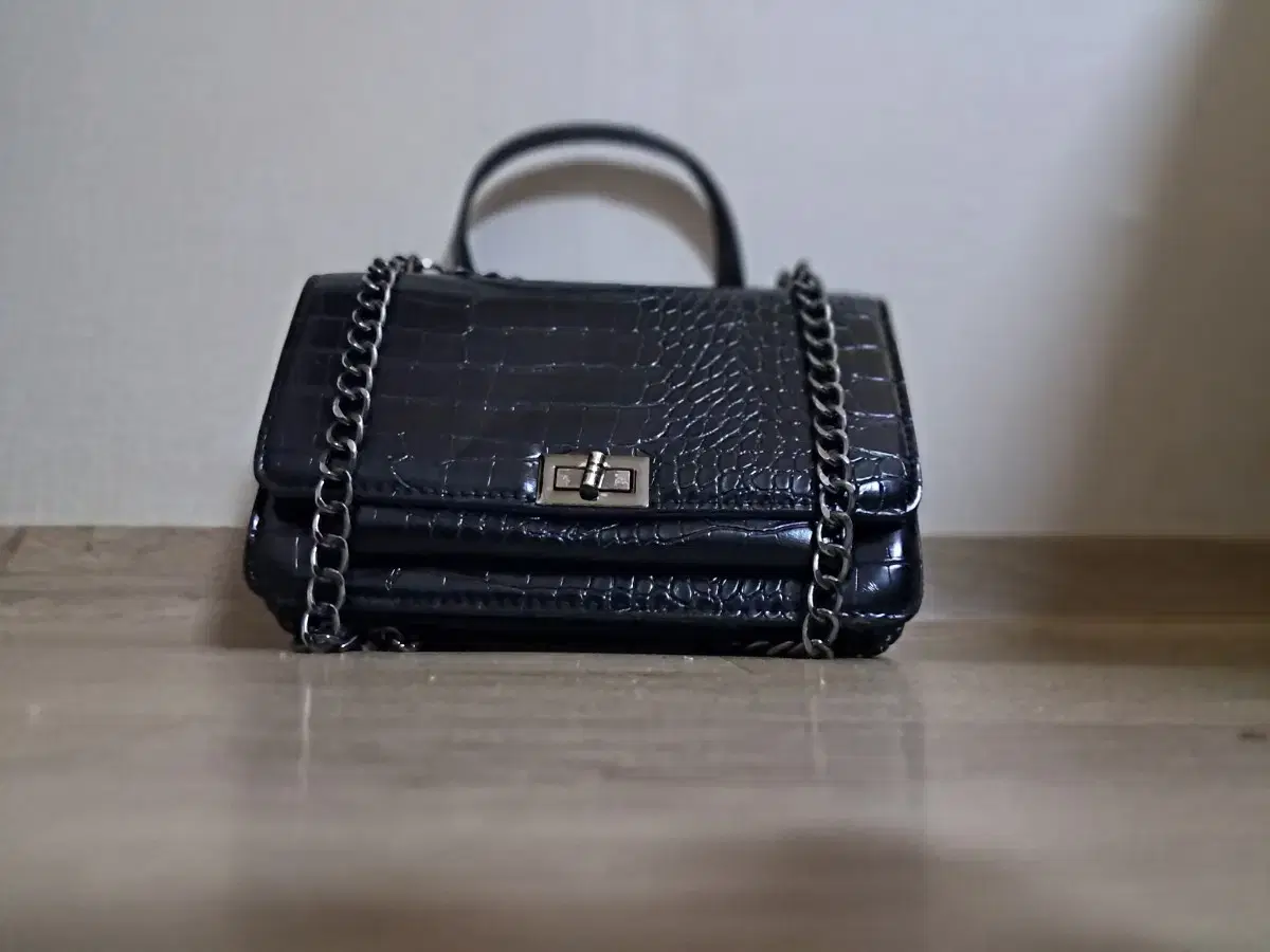 Selling a black leather handbag