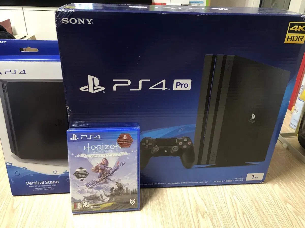 ps4 pro 1tb+조이패드2개+스탠드+게임CD새것