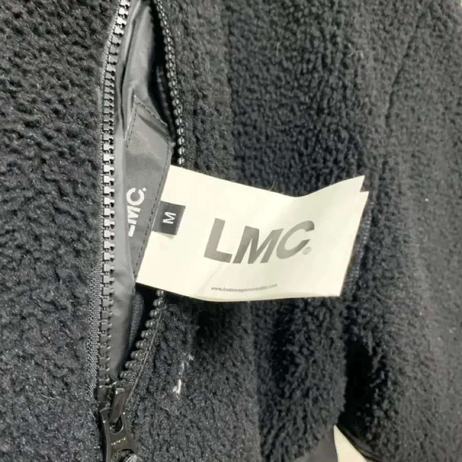 LMC 리버시블 패딩 100