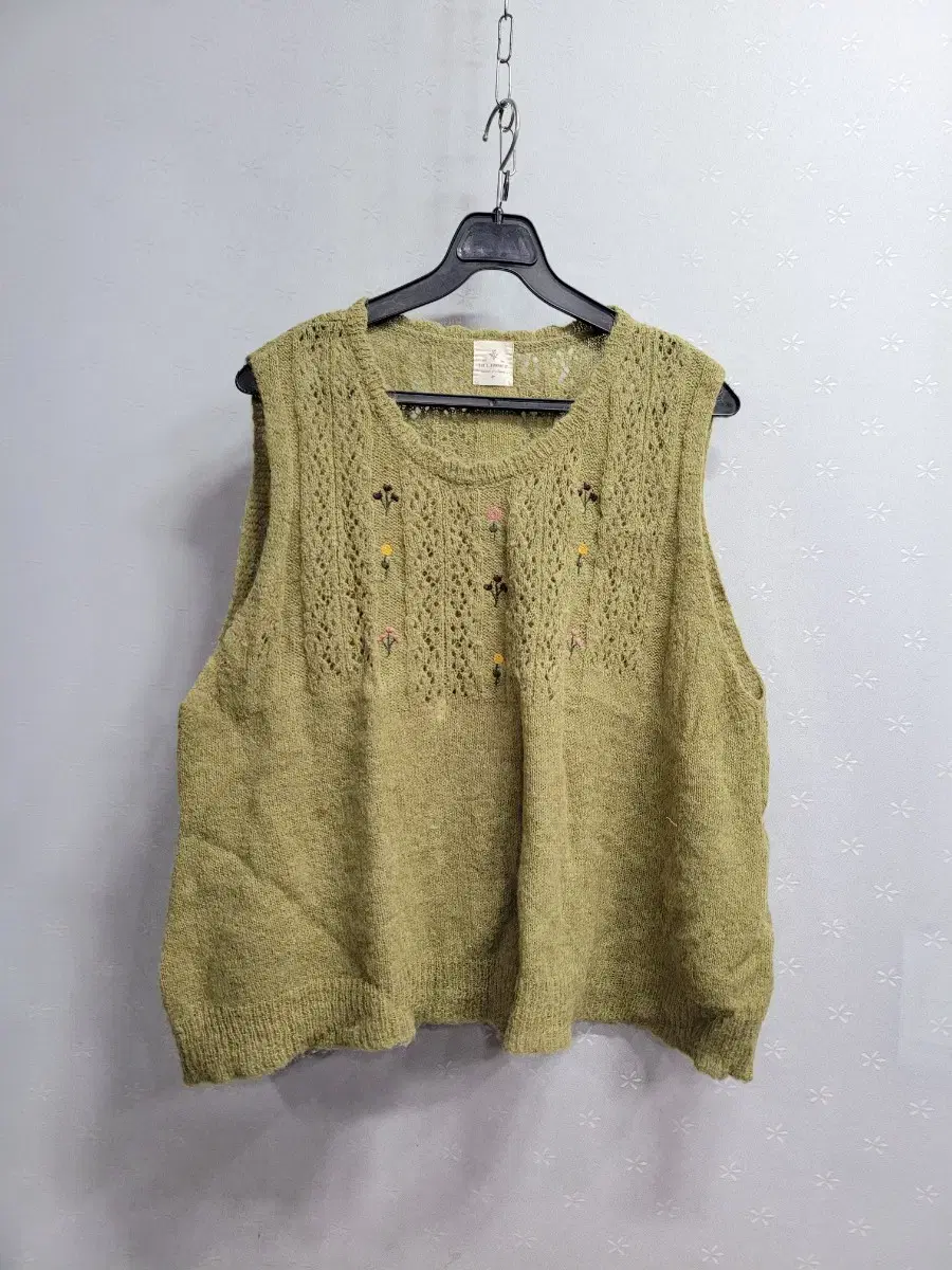 77) Embroidered knit vest