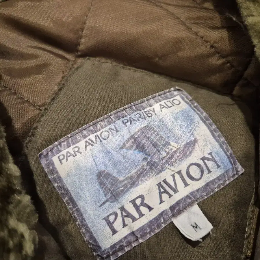 L~XL>PAR AVION 패디드 자켓