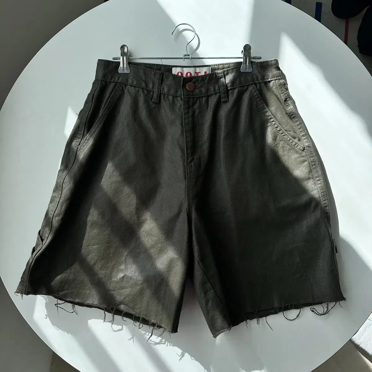 destroyed fake leather shorts