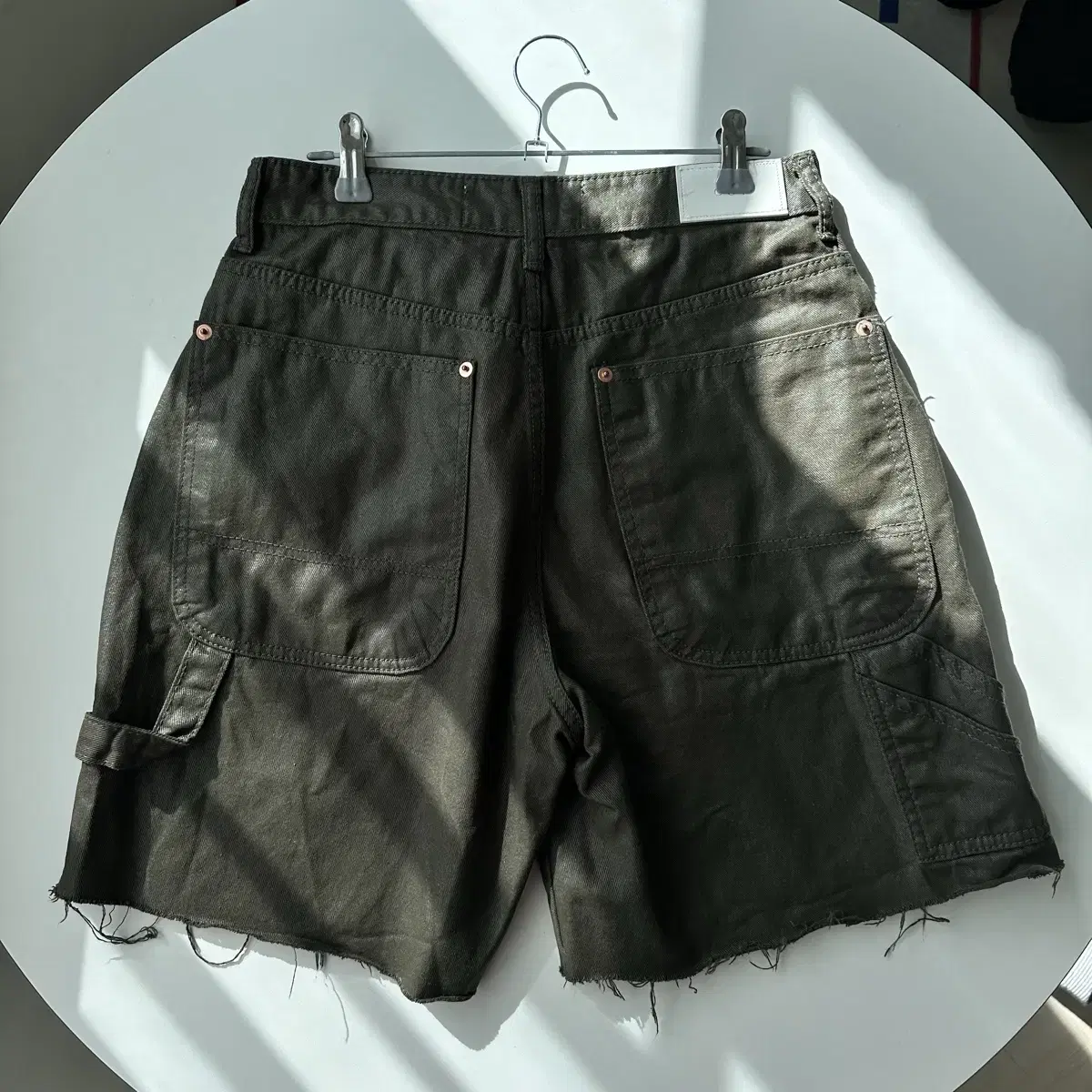 destroyed fake leather shorts