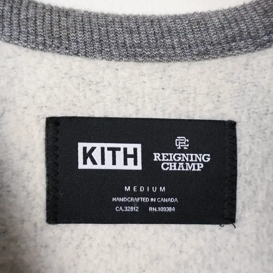 95/KITH X 레이닝 챔프 스웻셔츠