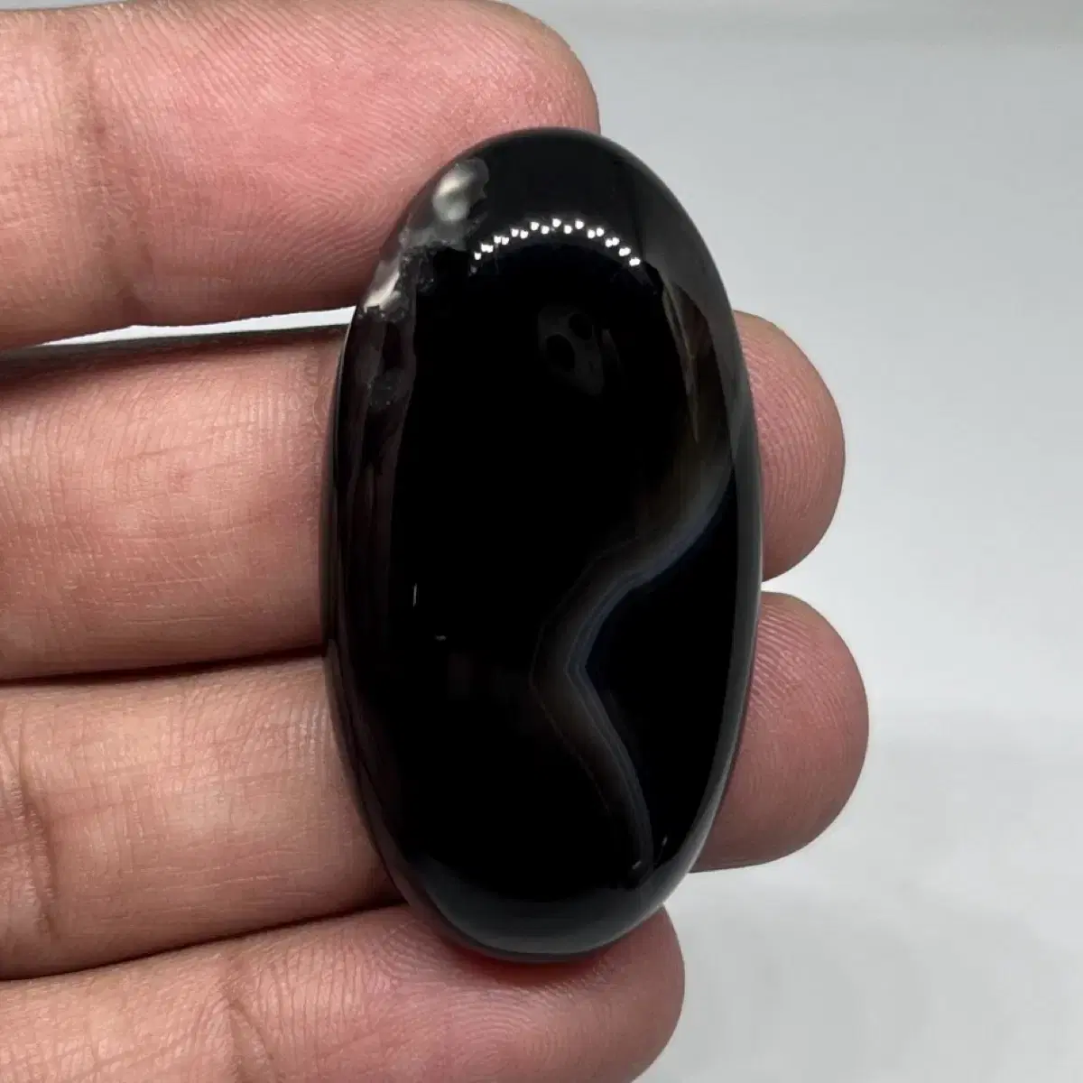 Black onyx (banded agate) cabochon