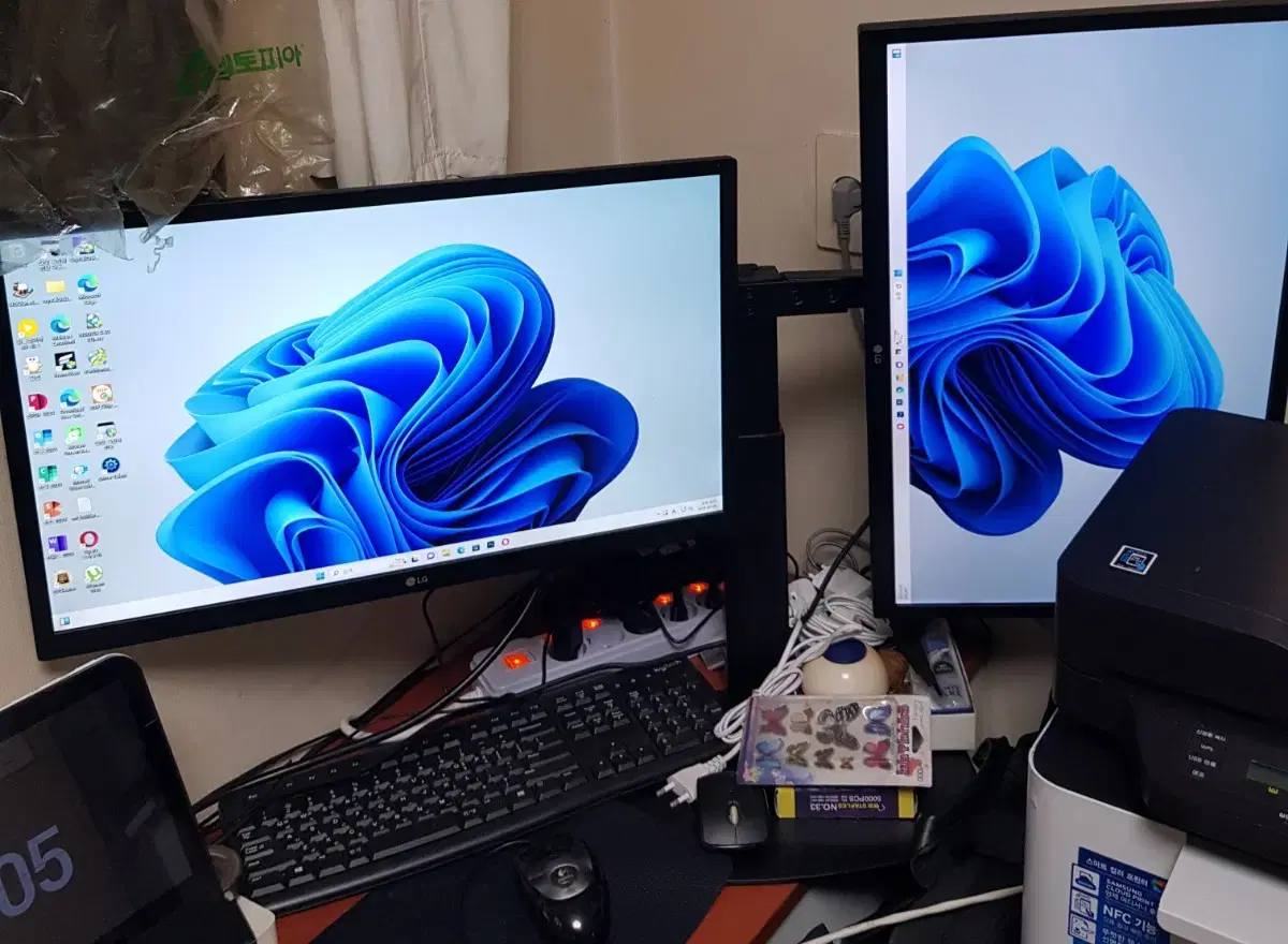 Two LG high-performance 24-inch monitors and a monitor arm