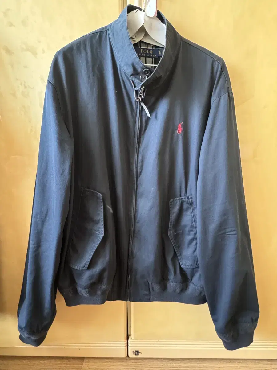 We are selling a Polo Harrington jacket, navy, XL.