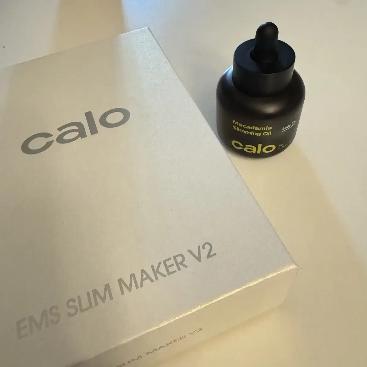 EMS Slim Maker + Slimming Oil with a knife