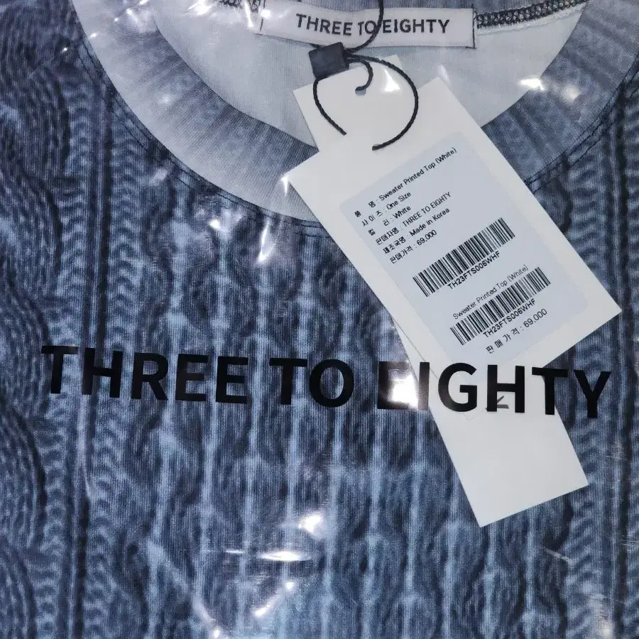 three to eighty sweater printed top