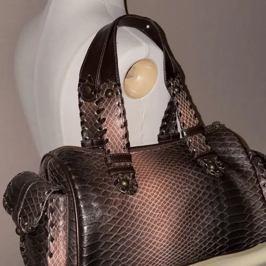 a snake-patterned leather vintage bag