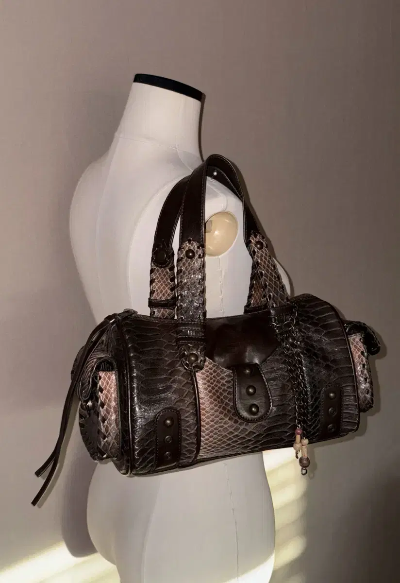 a snake-patterned leather vintage bag