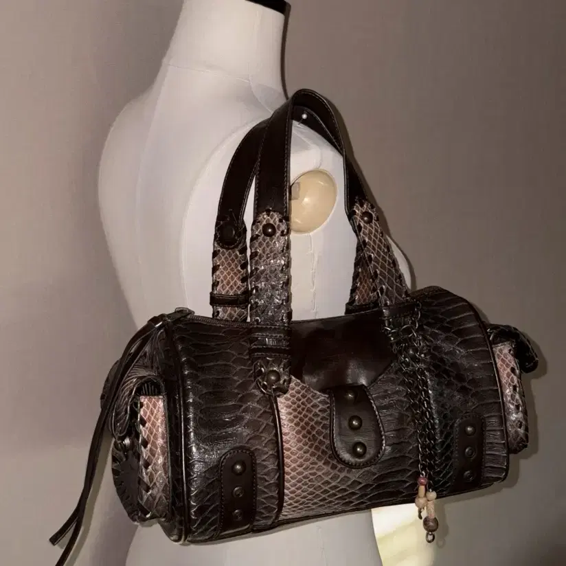 a snake-patterned leather vintage bag