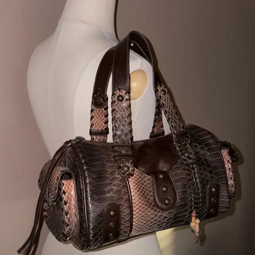 a snake-patterned leather vintage bag