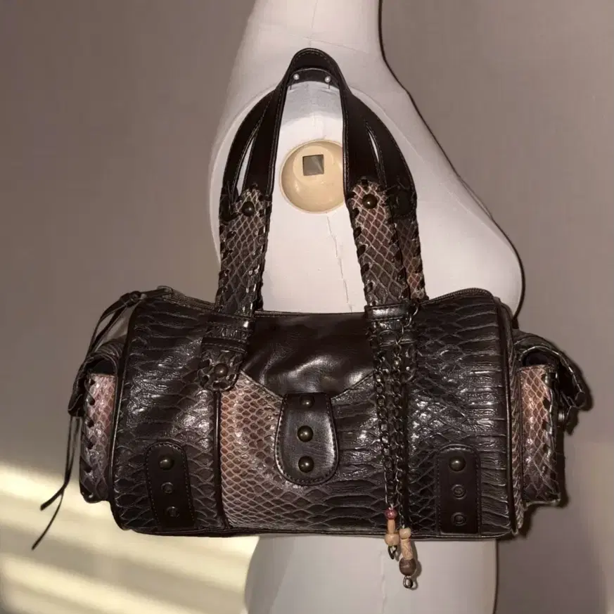 a snake-patterned leather vintage bag