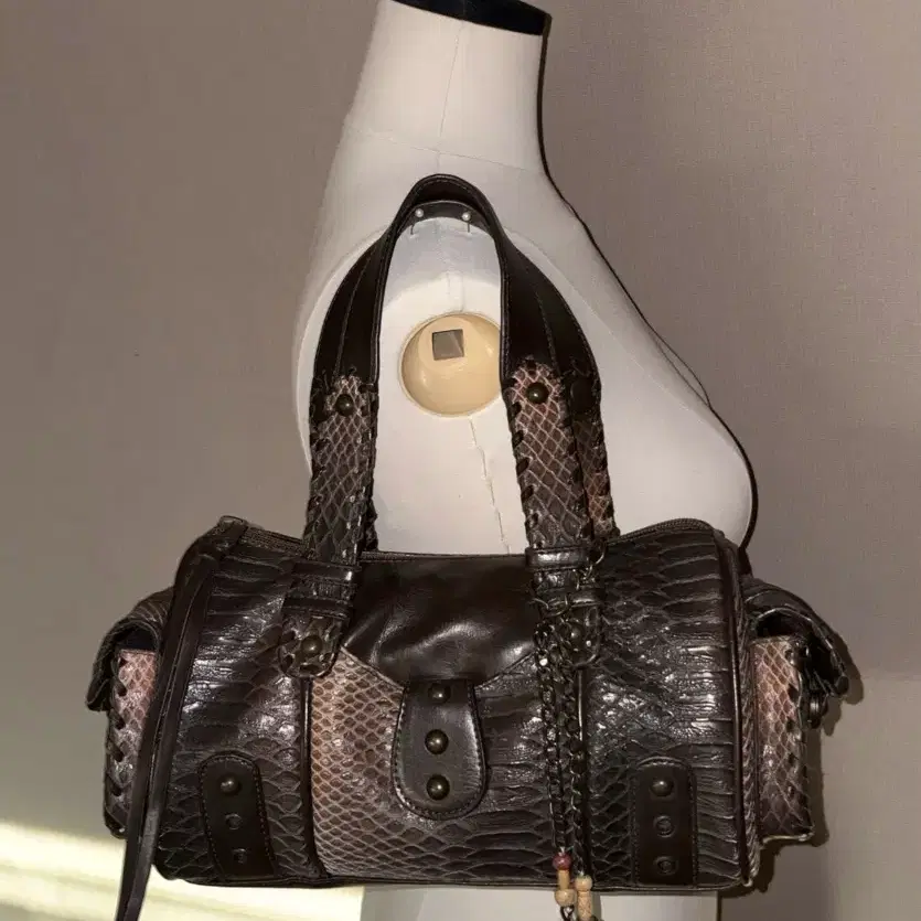 a snake-patterned leather vintage bag