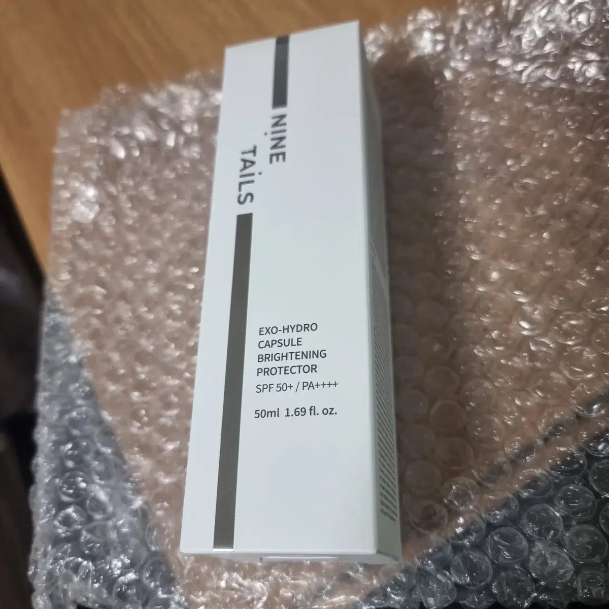 나인테일즈 엑소 하이드로 캡슐 브라이트닝 프로텍터 50ml