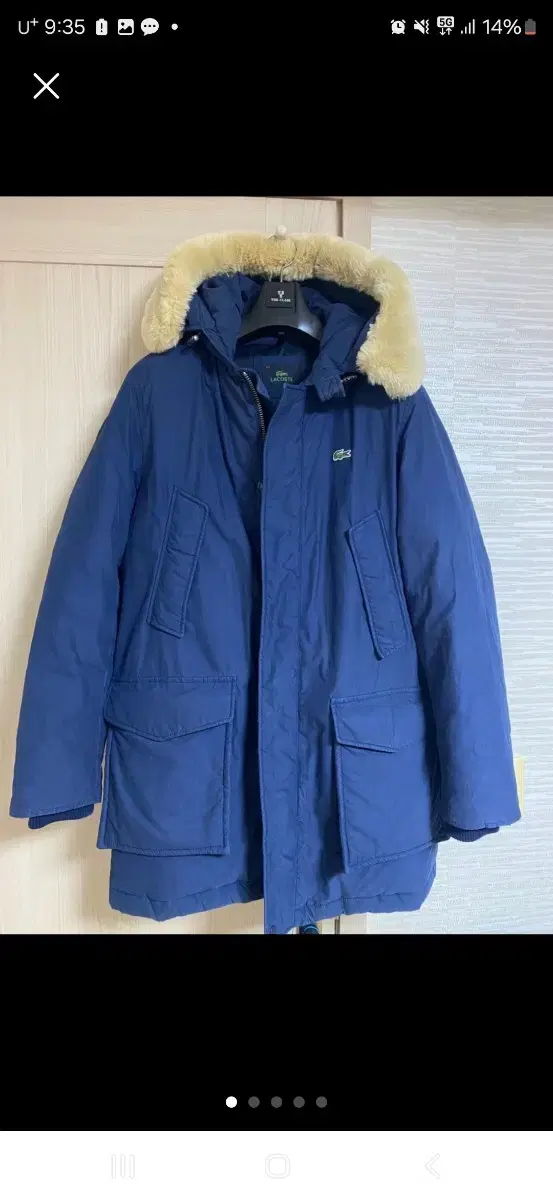 Lacoste down jacket size 52 is about 105 (XL). The fur on the hat can be removed.