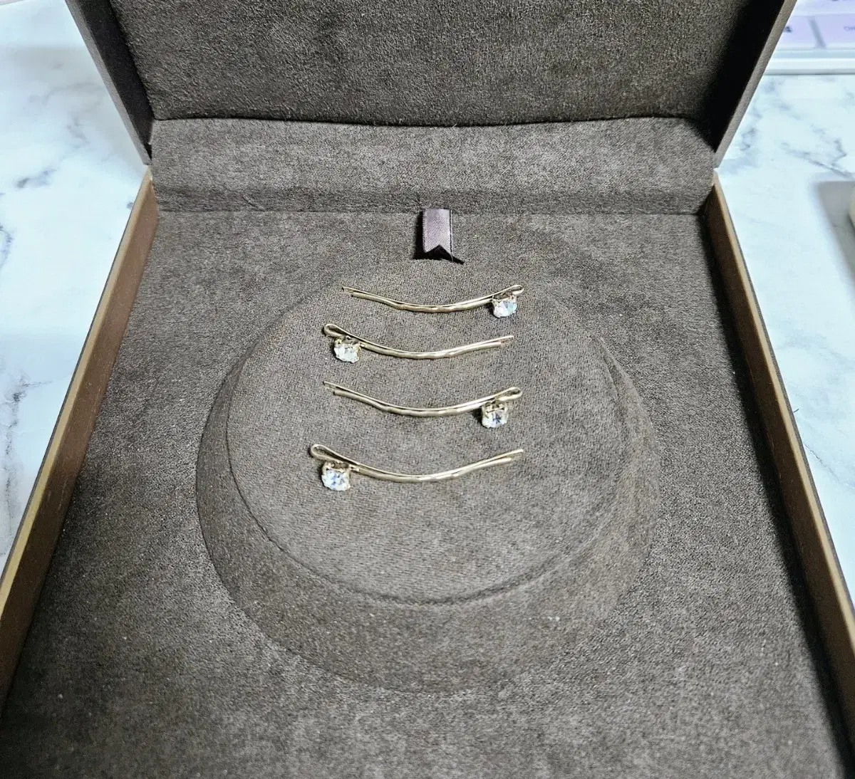 A set of four bent cubic hairpins