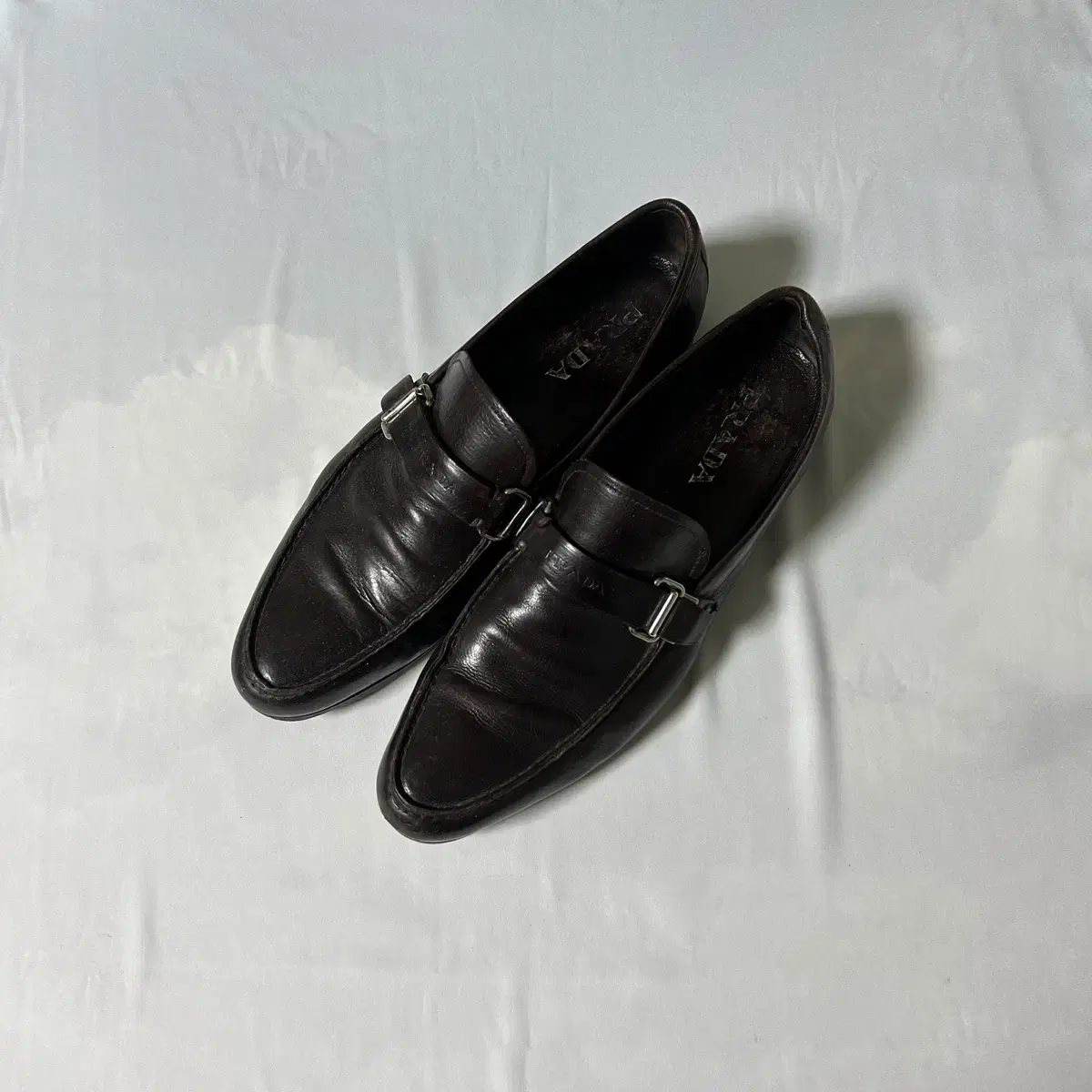 Prada buckle strap loafers dark brown