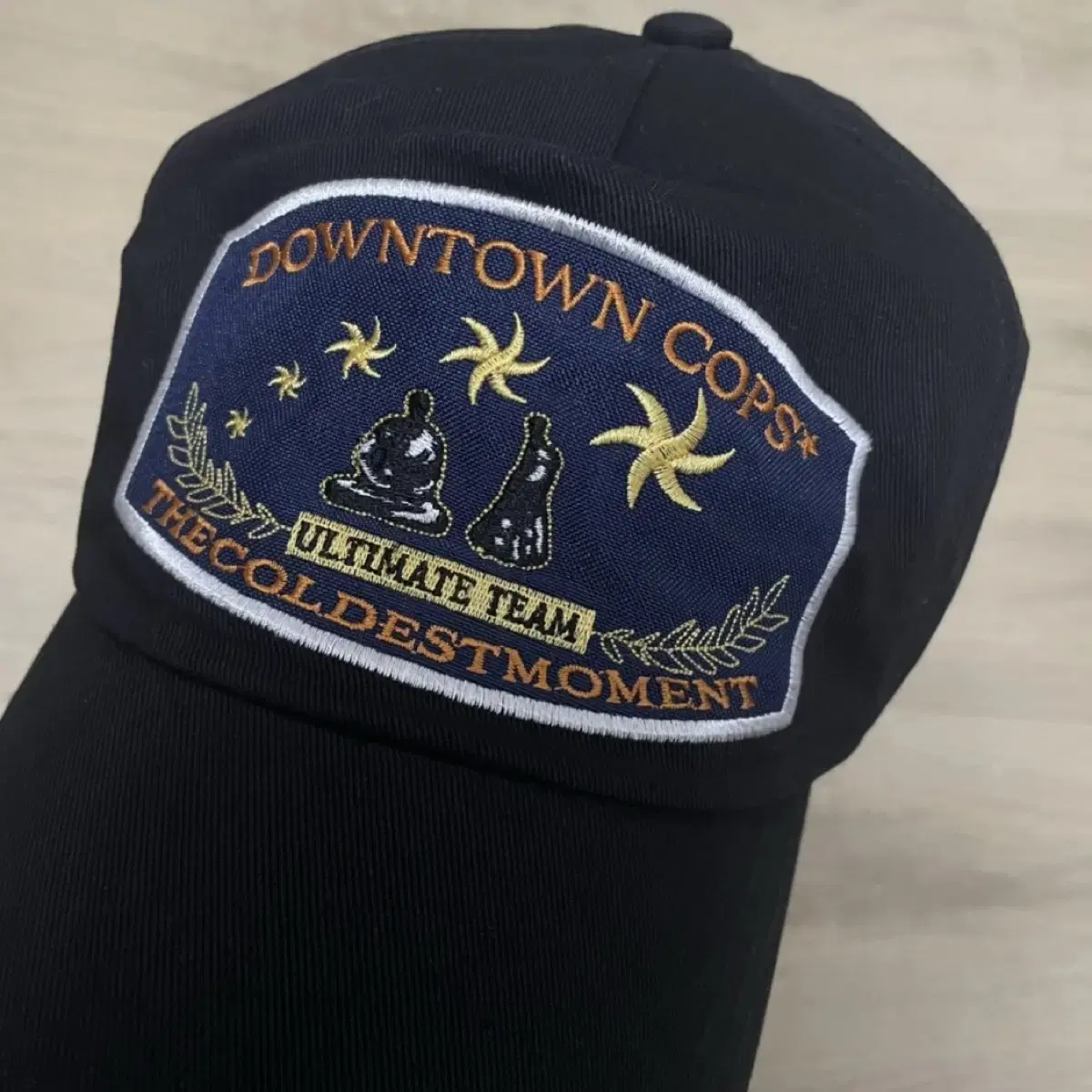 더콜디스트모먼트 TCM downtown cops cap