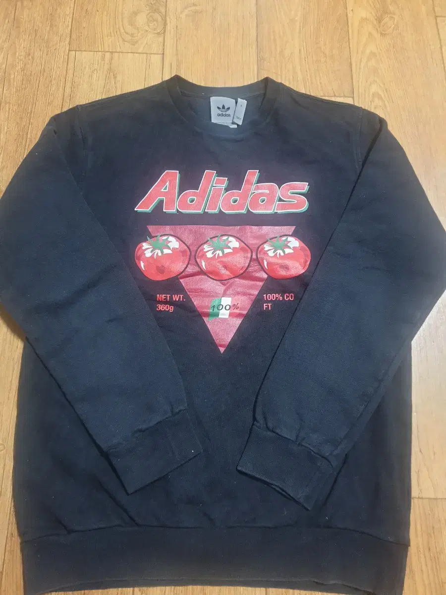 This is a size 100 Adidas Round Tee.