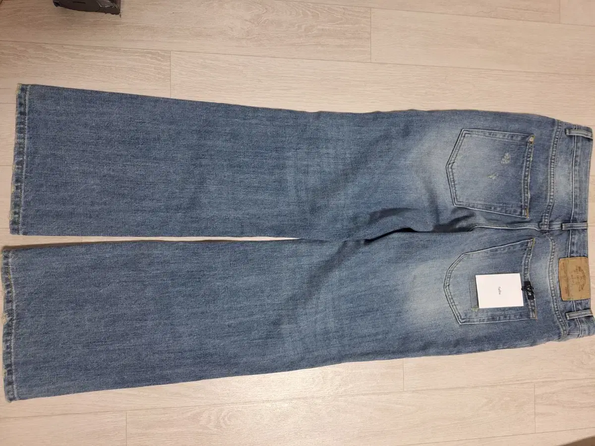 타일레/RON WASH BOOT DENIM PANTS