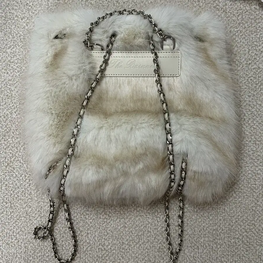 더바넷 Ivory Fur Drawstring Backpack