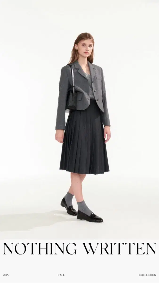 낫띵리튼 Classic pleated mid-skirt