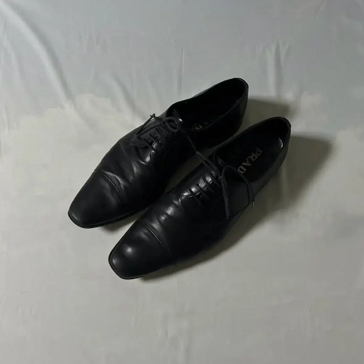 [280] Prada cap toe derby shoes