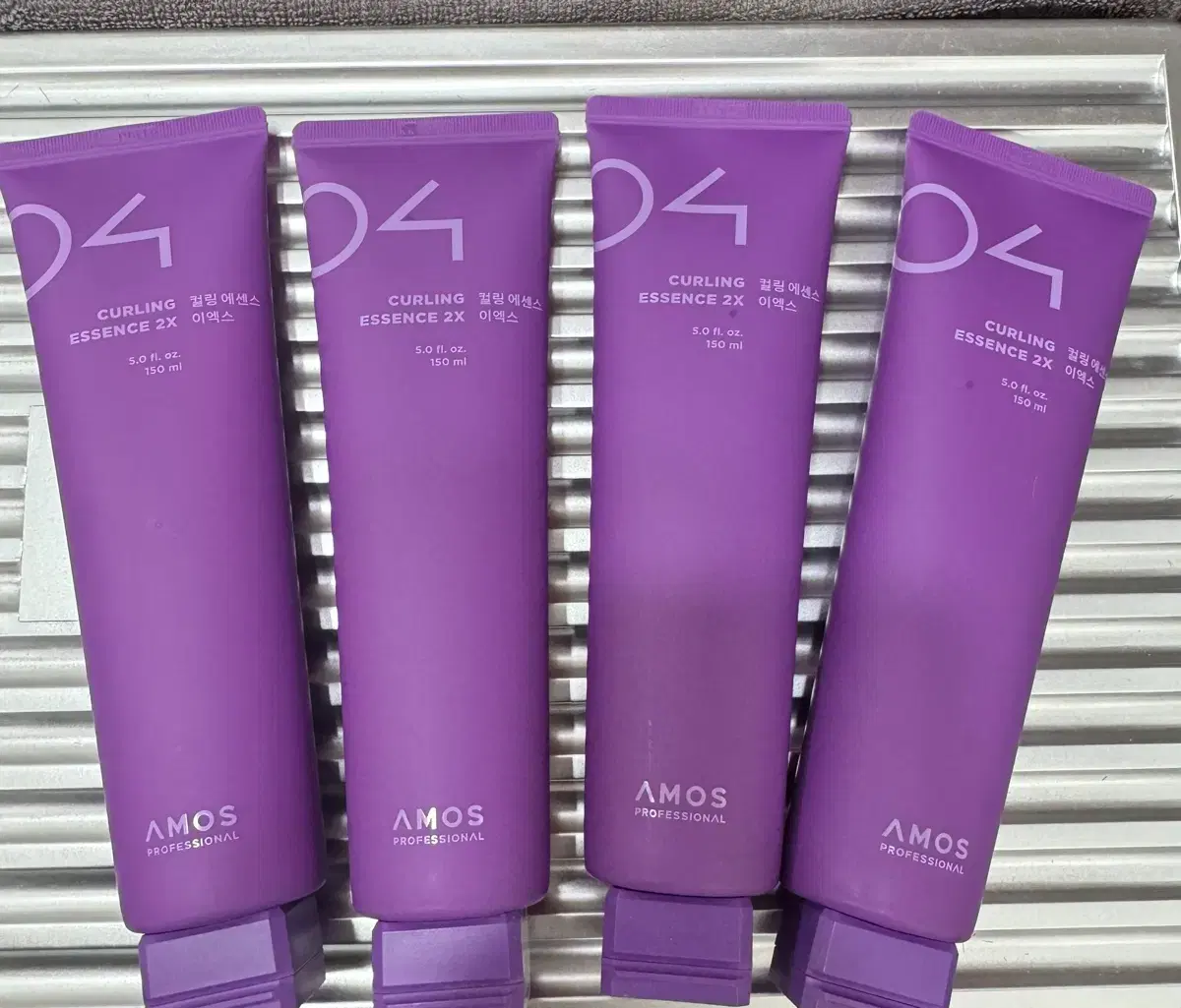 4 bottles of Amos Curl Essence