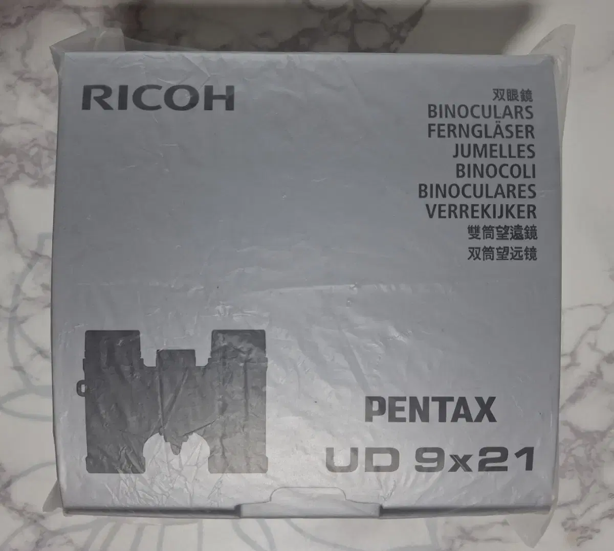 Two types of RICOH PENTAX UD binocular telescopes