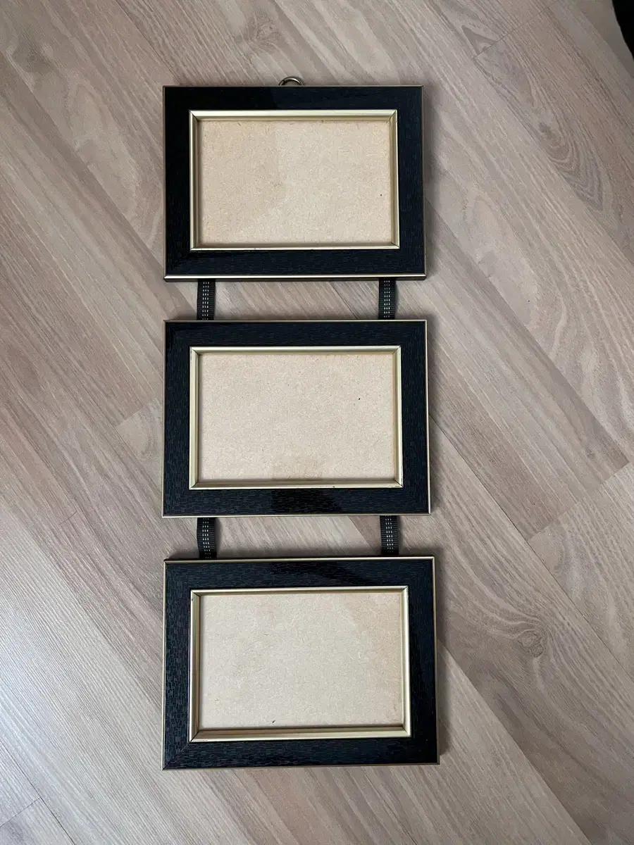 Wall-mounted photo frames in a row 3-tiered photo frames