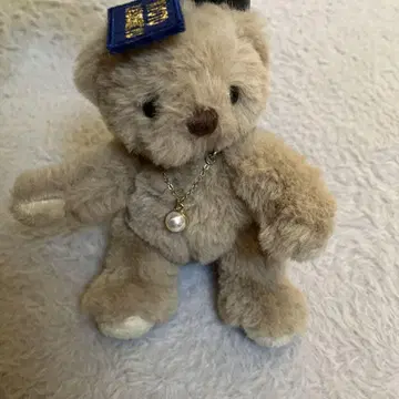베이지색 곰 봉제 인형 목걸이 포함